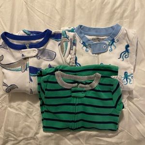 3 size 24mo onesie/foot pajamas. New condition.